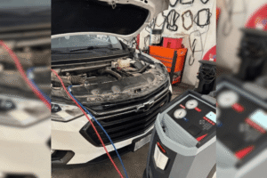Summer preventative maintenance, auto repair in Belton, MO, at Belton Transmission & Complete Auto Repair. Image of a Chevrolet SUV connected to an A/C service machine during automotive air conditioning diagnostics and refrigerant recharge at a professional auto repair shop.