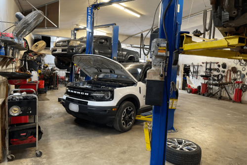 Auto repair near Raymore, MO by Belton Transmission & Complete Auto Repair. Image of a Ford Bronco undergoing service in a professional repair shop, showcasing the team’s dedication to keeping vehicles reliable and road-ready.